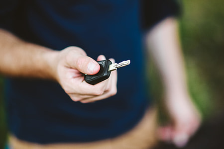 Young man holding car keys