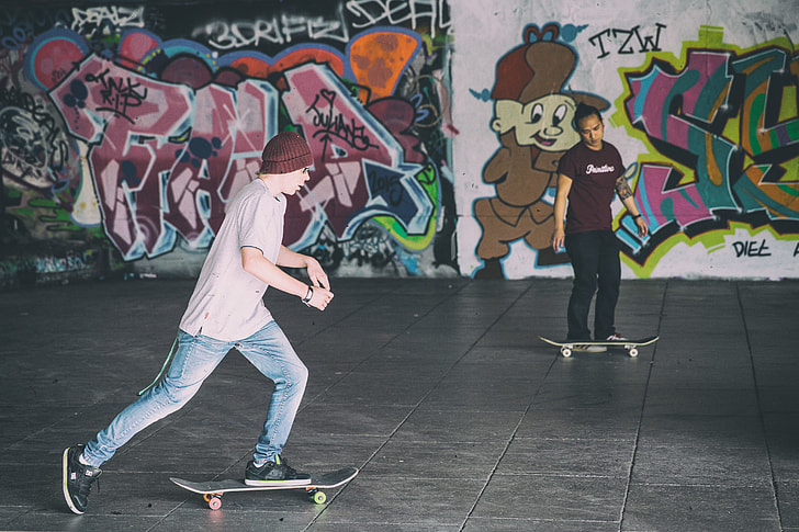 Two skateboarders in action, captured on the Southbank in London, England. Image shot with a Canon 6D DSLR