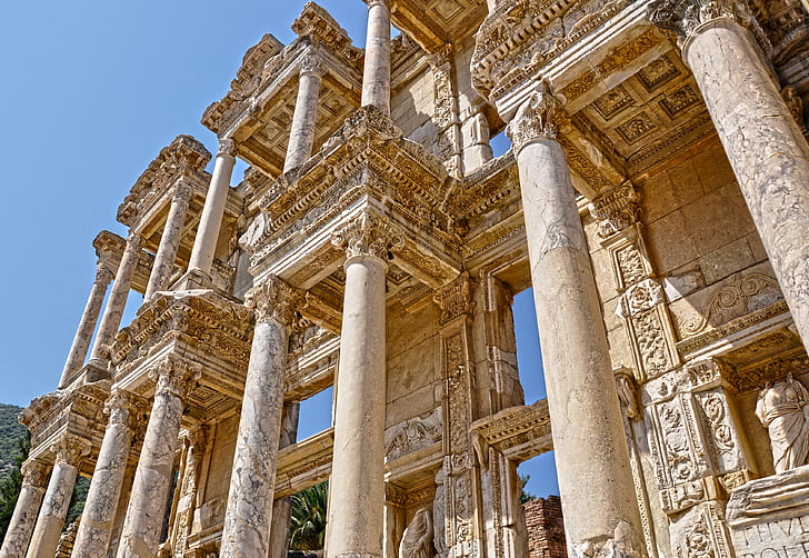 closeup photo of pillars and statues
