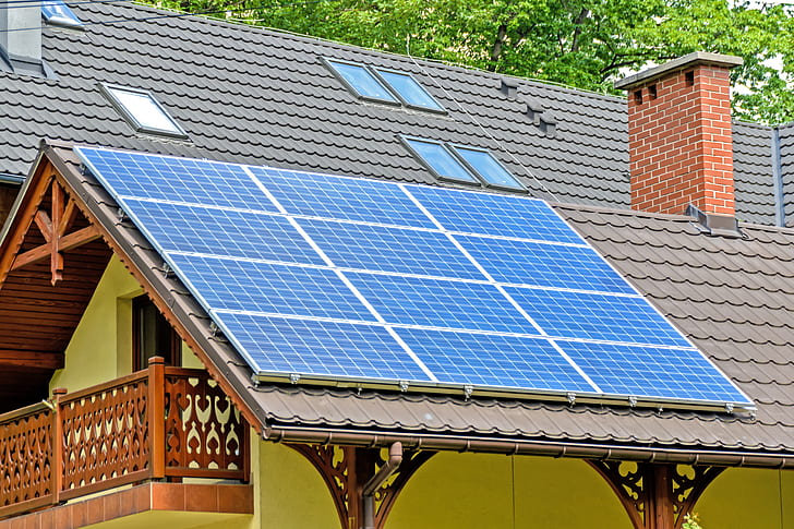 blue and white solar panel on gray roof