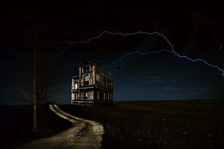 photo of building with lightning during night time