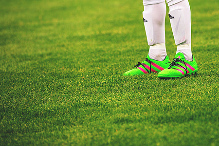 Feet and football boots of a male soccer player