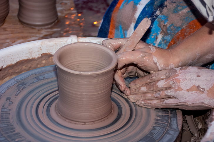 Potter Hands Making In Clay On Pottery Wheel. Potter Makes A Pottery On The Pottery  Wheel Clay Pot. Stock Photo, Picture and Royalty Free Image. Image 43434771.