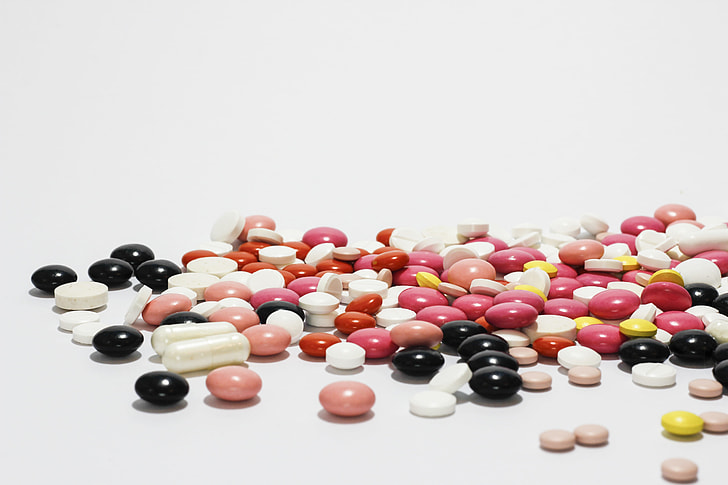 assorted-color medication tablets