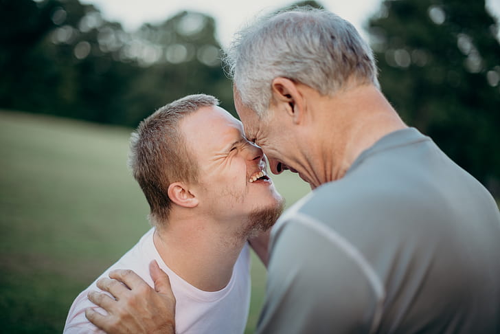 photo of two men nose to nose with each other