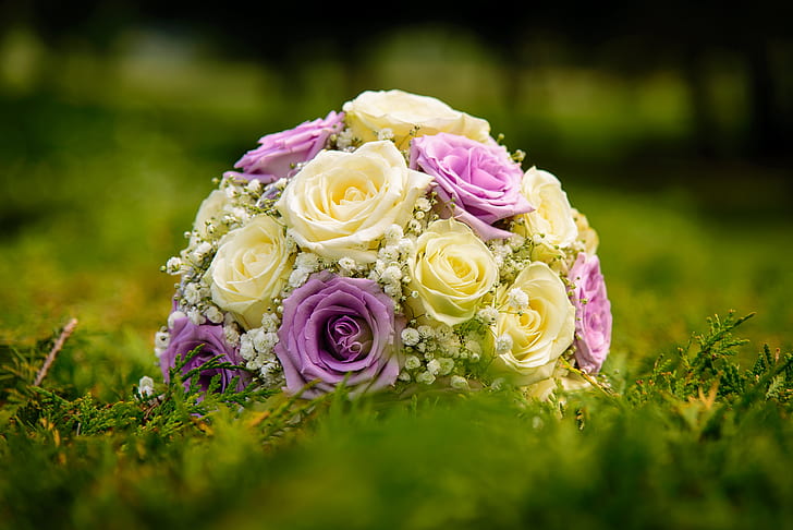 beige and pink floral bouquet on green grass