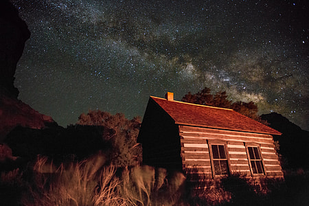 A house in the national park at Utah under the night stars and sky