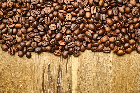 coffee beans on brown table surface