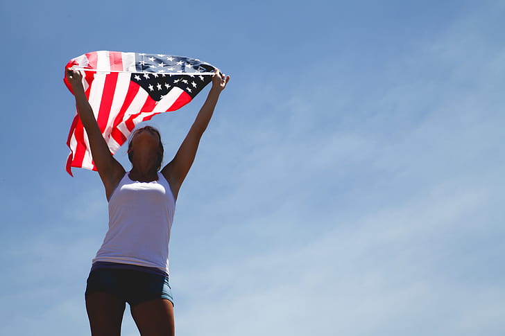 woman holding U.S.A. flag