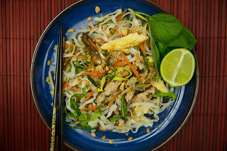 Overhead shot of Pad Thai noodles with chopsticks