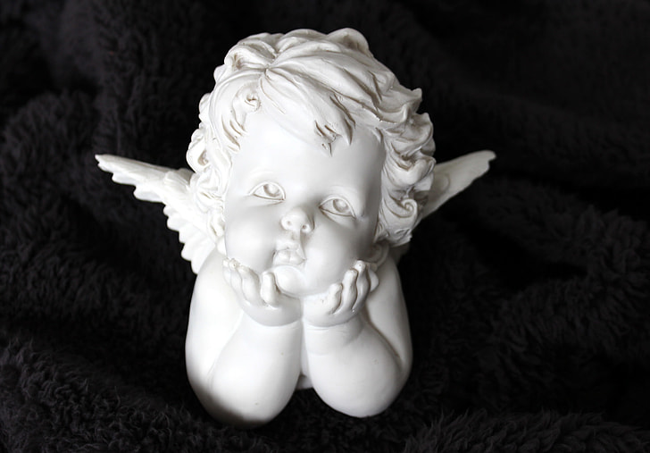 cherub ceramic figurine