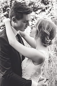 grayscale photography of newly wed couple hugging each other