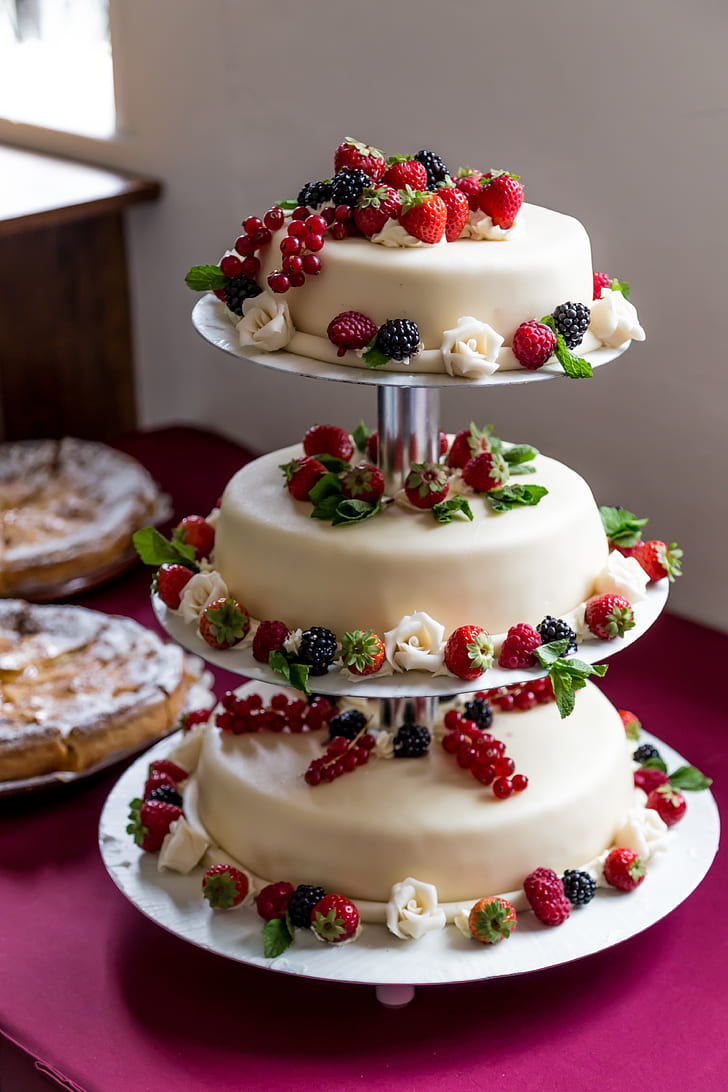 white icing-coated 3-tier cake