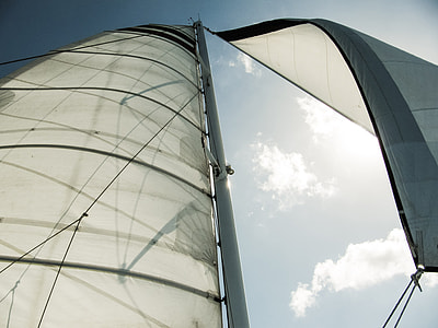 low angle photography of white sailboat during daytime
