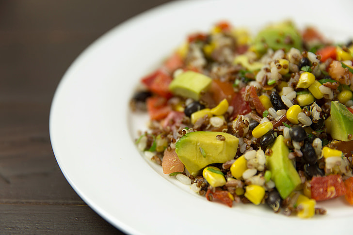 Mexican salad with rice, beans, quinoa and avocado