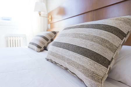 two gray striped bed pillows