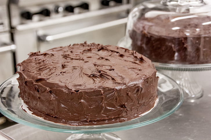 chocolate fondue cake on glass cake stand