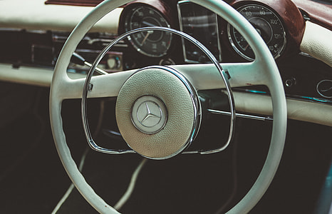 image contains close up photo of Mercedez Benz car steering wheel