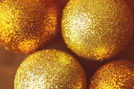 Closeup macro shot of golden Xmas glitter ball decorations. Image captured with a Canon 6D and 100m macro lens