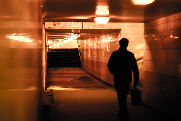 man walking inside subway