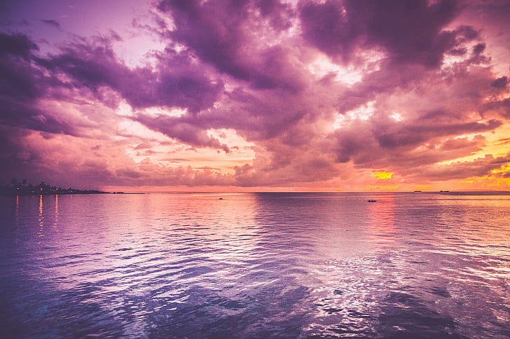 Pink purple sky during sunset over water background vertical Stock Photo by  carlo_vstek