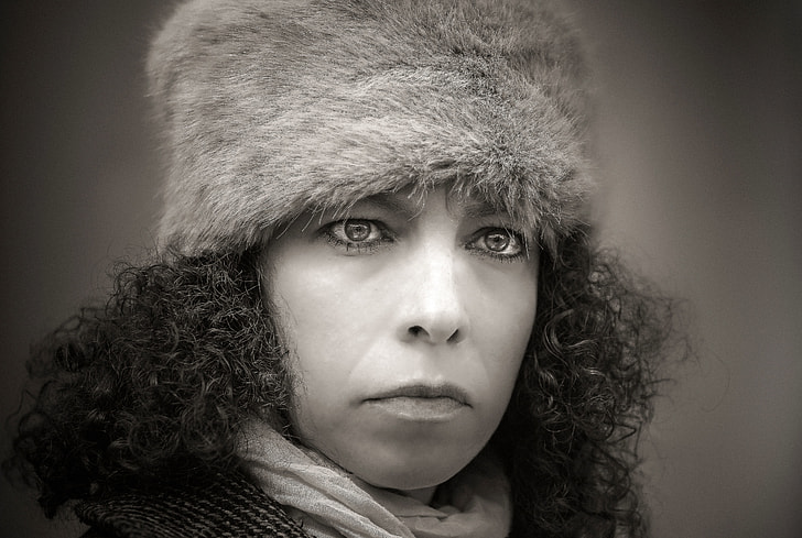 long curly hair woman wearing fur hat