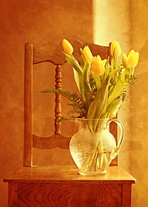 clear glass pitcher with flowers