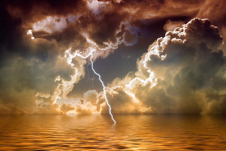 photo of lightning hitting body of water