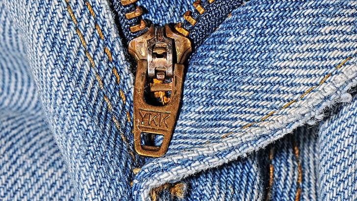 brass zipper and blue denim bottoms