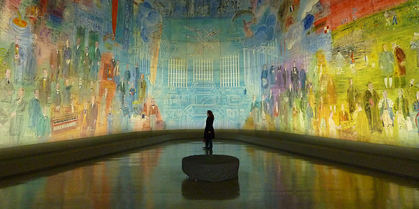 person standing inside mural printed room