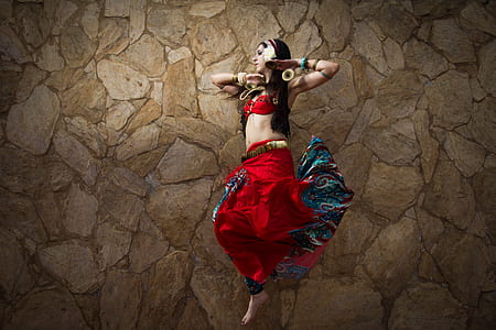 woman wearing red skirt dancing