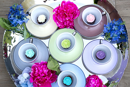 photography of assorted-color cupcakes