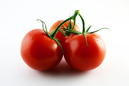 three raw tomatoes