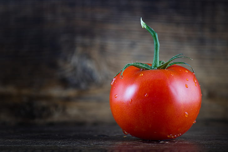 close-up photo of tomato with water droplets