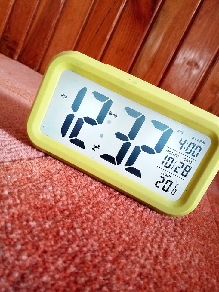 Close-Up Photography of Yellow Alarm Clock