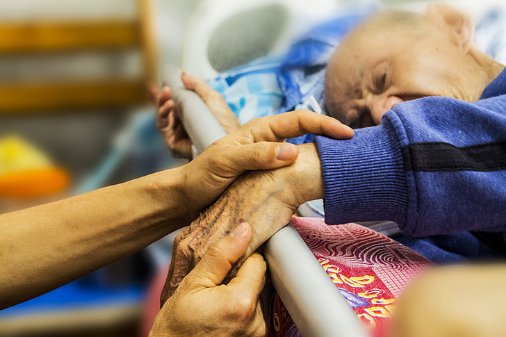 person, holding hands, man, bed, hospice, caring