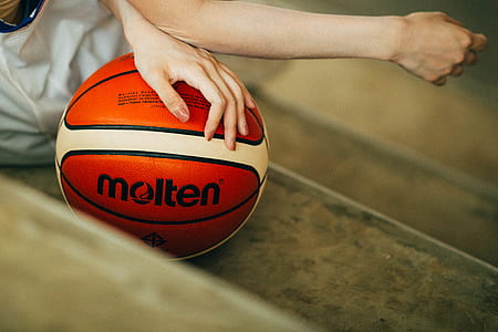 person holding Molten basketball