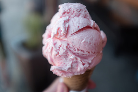 Closeup shot of pink ice cream cone