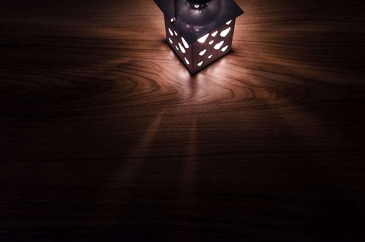 black lamp on brown wooden board