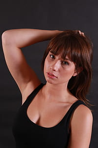 woman in black tank top posing for photo