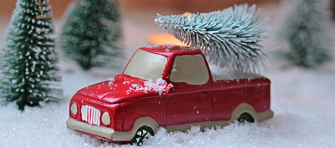 red pick-up truck on snow