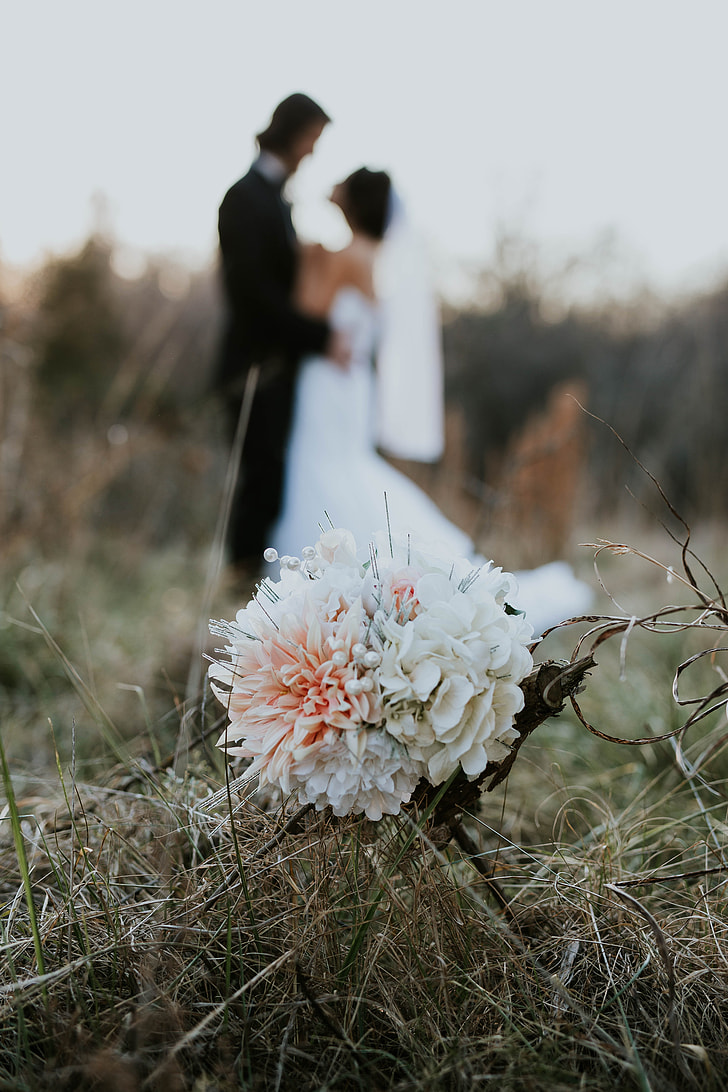 photo of white flower with newly wed background