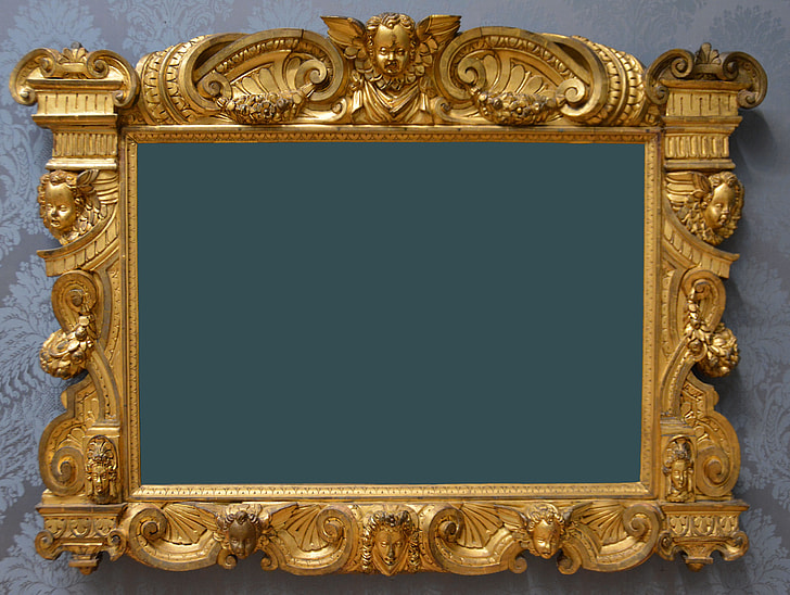 photo of cherub embossed brass-colored photo frame