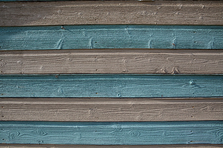 Close-up shot of blue and cream-coloured wood panels. Image captured in Kent, England