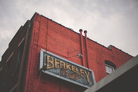 Berkeley signage mounted on red concrete building
