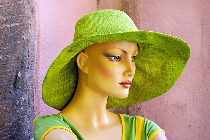 green hat and green dress on mannequin