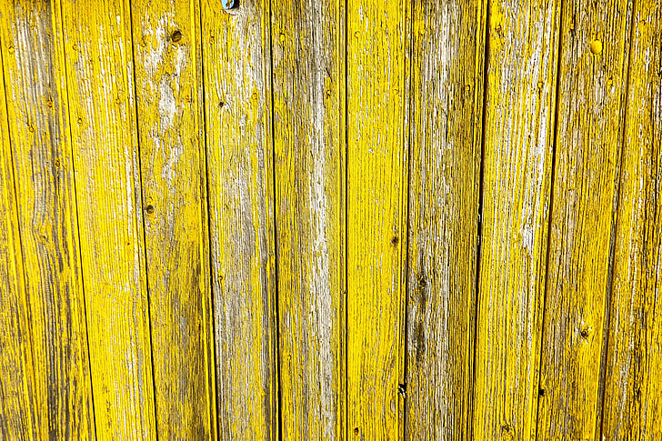Closeup shot of yellow wood fence