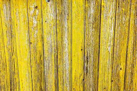 Closeup shot of yellow wood fence