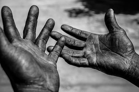 grayscale photo of person's hands