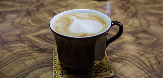 Cappuccino on Black Ceramic Mug